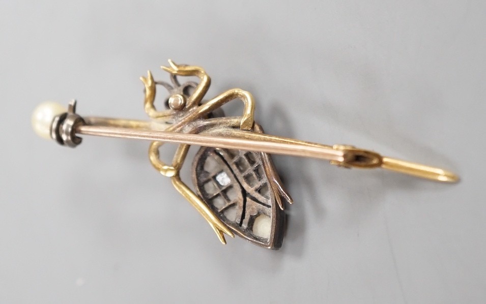 An early 20th century white and yellow metal, rose cut diamond and split pearl cluster set bug bar brooch, 49mm, gross weight 4.6 grams.